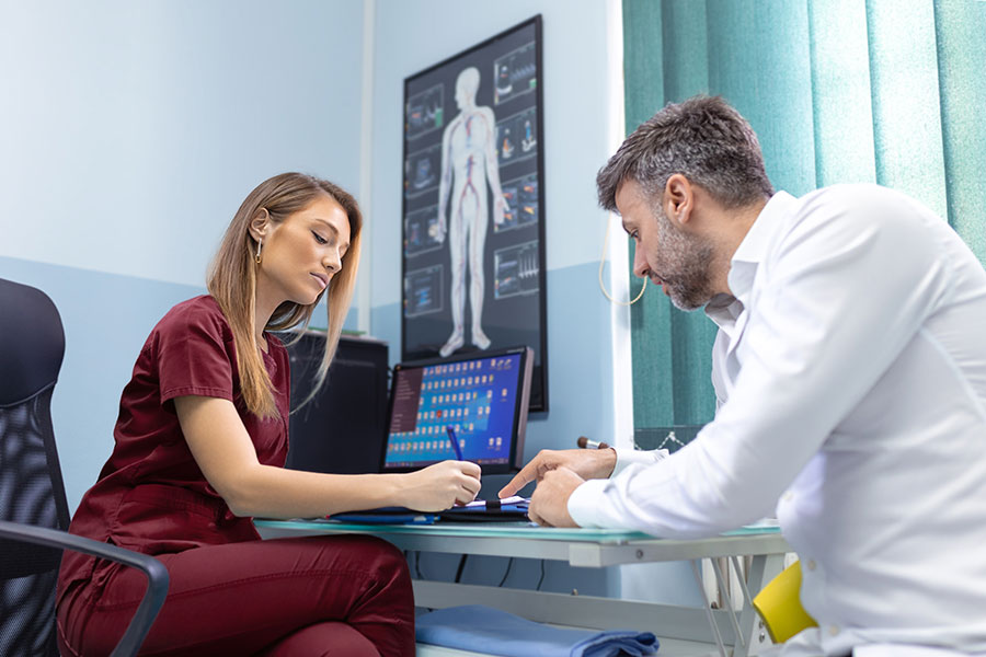 Patient receiving confidential sexual health advice during a private consultation at Glasgow Medical Rooms.